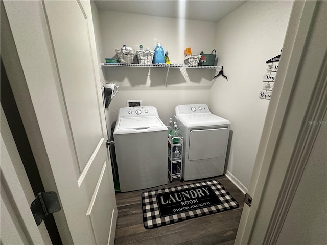 washroom with wood-type flooring and independent washer and dryer