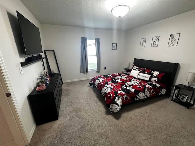 carpeted bedroom with a textured ceiling