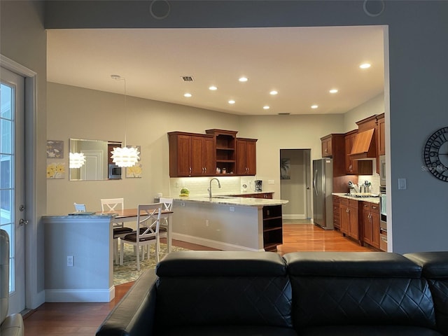 living room featuring sink and light wood-type flooring