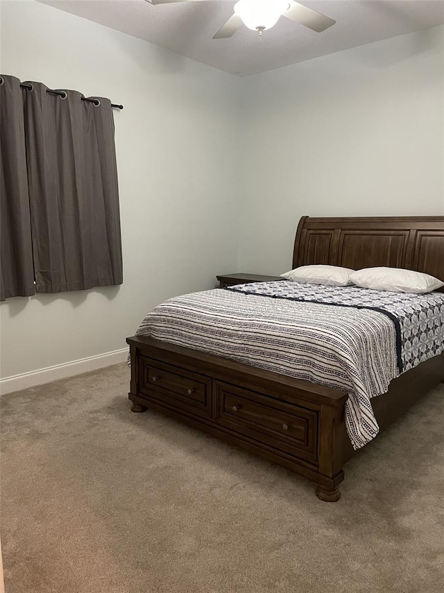 bedroom featuring ceiling fan and carpet floors