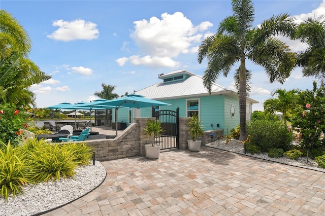 back of property featuring a patio area