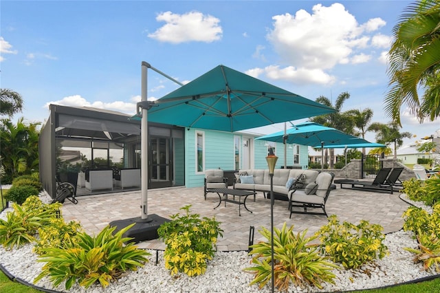 view of patio / terrace with an outdoor living space and a lanai