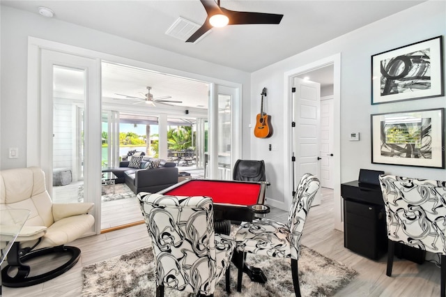 recreation room featuring light wood-type flooring and ceiling fan