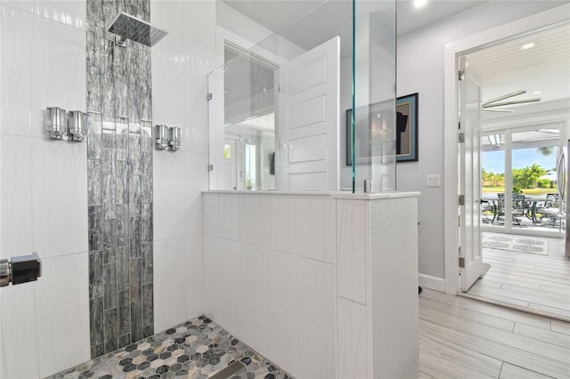 bathroom with a tile shower