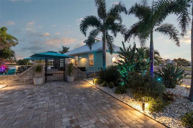 view of patio terrace at dusk