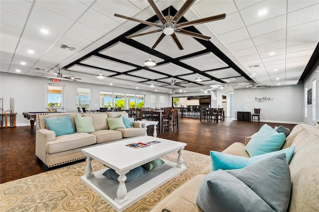 living room featuring ceiling fan and wood-type flooring