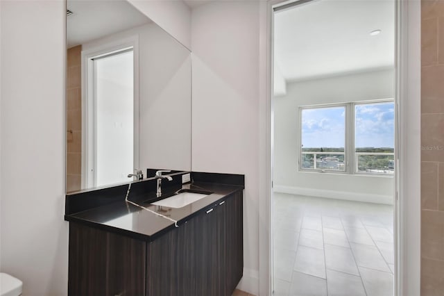 bathroom featuring tile patterned flooring and vanity