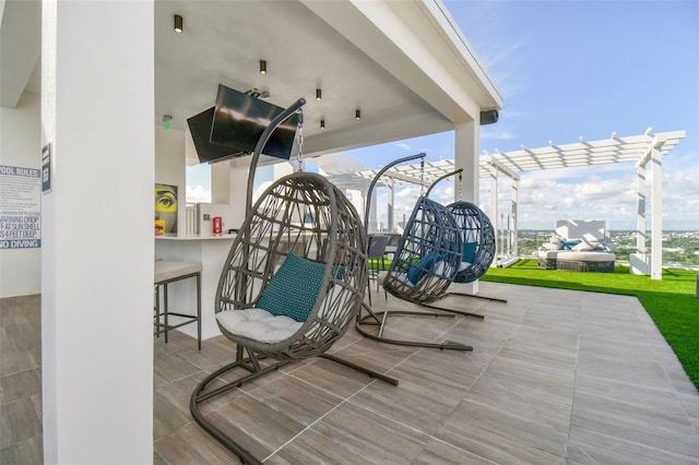 view of patio featuring a pergola and an outdoor bar