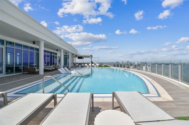 view of swimming pool featuring a patio area