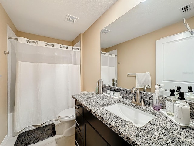 full bathroom featuring vanity, tile patterned floors, toilet, a textured ceiling, and shower / tub combo