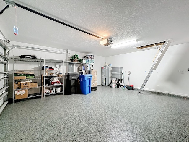 garage featuring water heater and a garage door opener