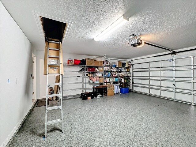 garage featuring a garage door opener