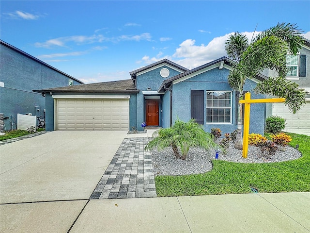 view of front of property featuring a garage