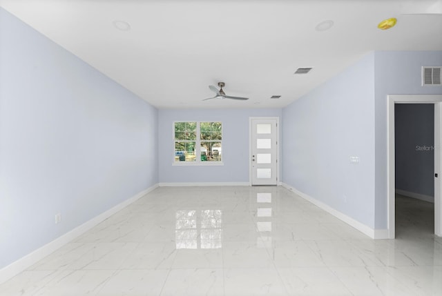 spare room with ceiling fan