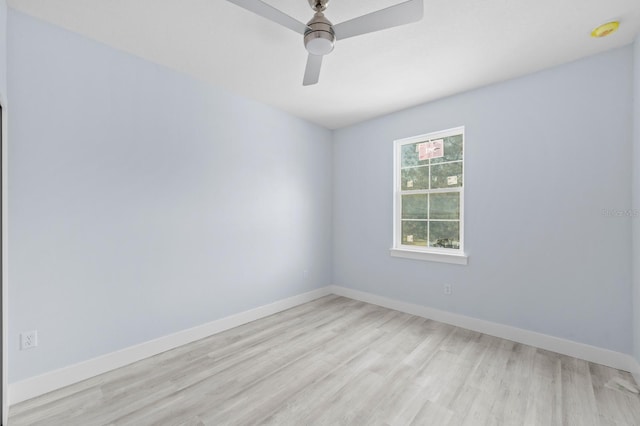 spare room featuring light hardwood / wood-style floors and ceiling fan