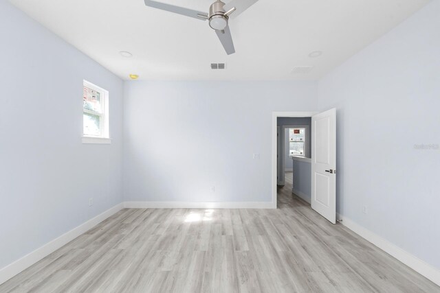 unfurnished room with ceiling fan and light wood-type flooring