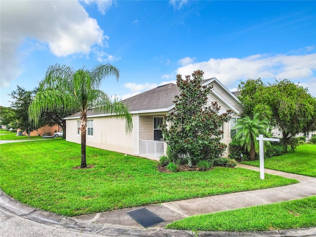 view of side of property featuring a yard