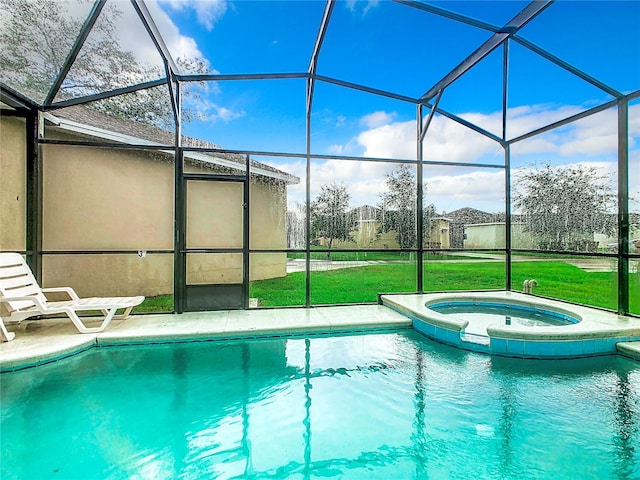 view of swimming pool with an in ground hot tub, a lawn, and glass enclosure