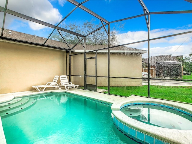 view of swimming pool with an in ground hot tub and a lanai