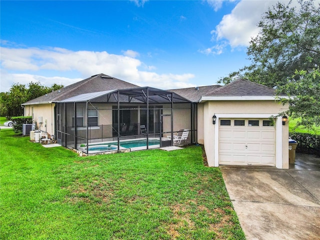 view of front of house featuring a garage, a front lawn, glass enclosure, and central AC unit