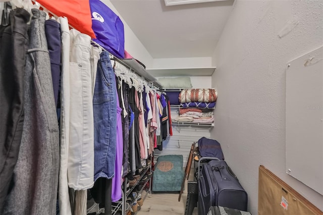 spacious closet featuring light hardwood / wood-style flooring