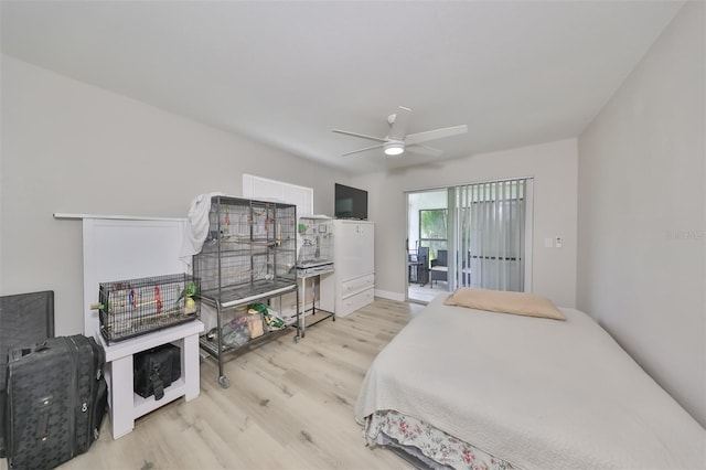 bedroom featuring ceiling fan, access to exterior, and light wood-type flooring