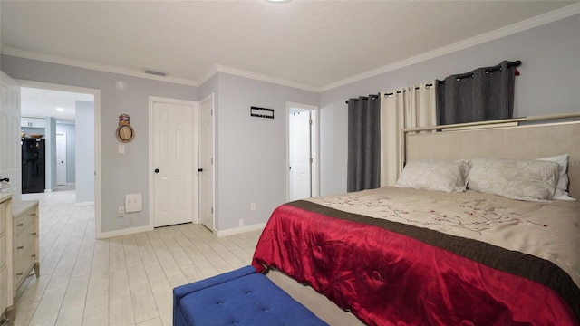 bedroom featuring black refrigerator, light hardwood / wood-style flooring, and ornamental molding