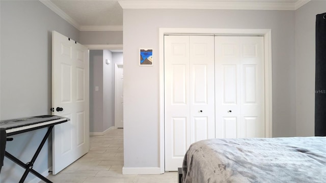 bedroom with light hardwood / wood-style floors, a closet, and crown molding