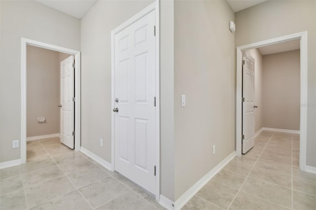 hallway featuring light tile patterned floors