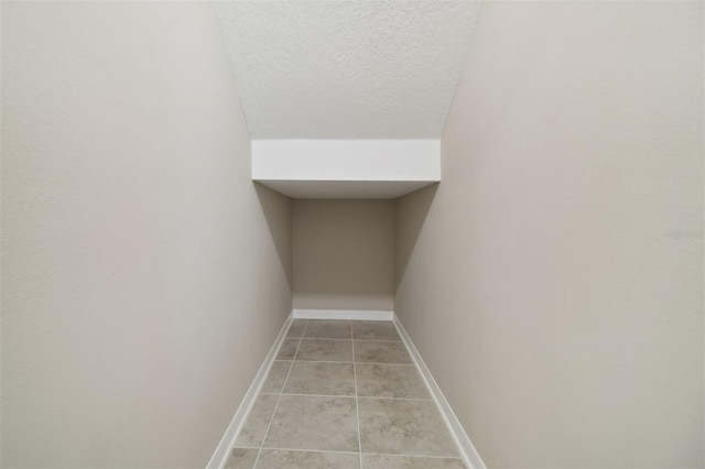 interior space with light tile patterned floors