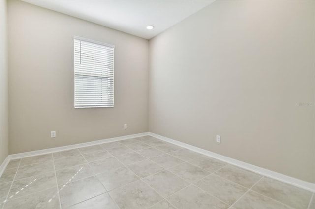 spare room with light tile patterned floors