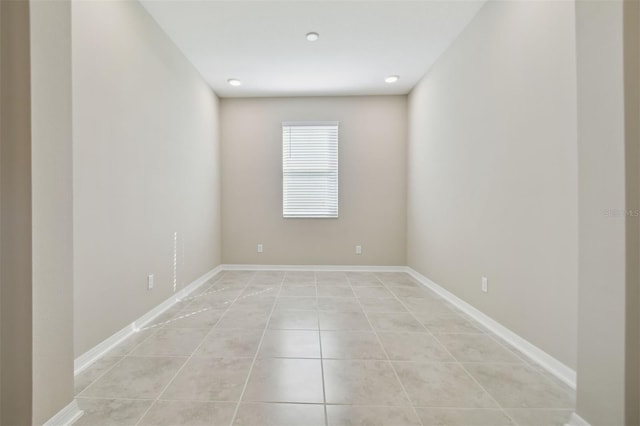 empty room with light tile patterned floors