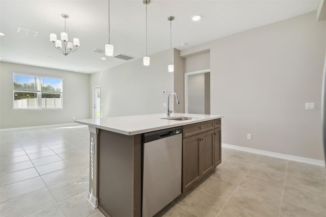 kitchen with dishwasher, pendant lighting, a center island with sink, and sink