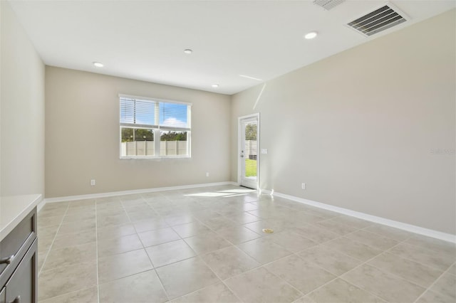 empty room featuring light tile patterned floors