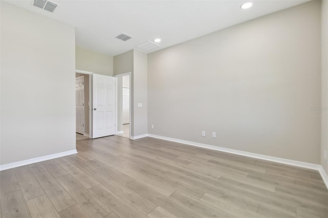 spare room with light wood-type flooring