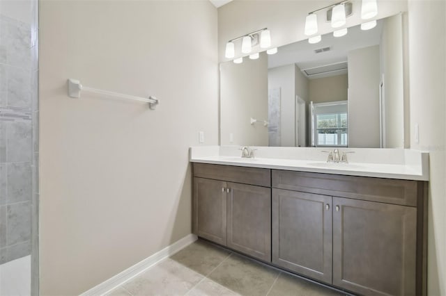 bathroom featuring tile patterned flooring and vanity