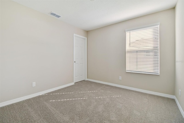 spare room featuring carpet flooring