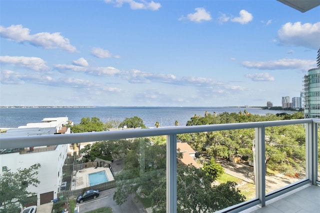 balcony featuring a water view