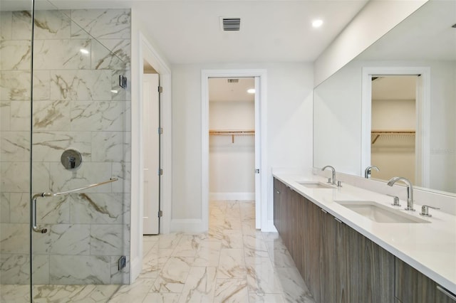 bathroom featuring vanity and a shower with shower door