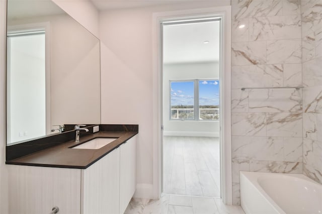 bathroom with vanity and a bathtub