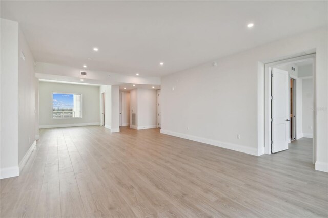 unfurnished living room with light hardwood / wood-style flooring