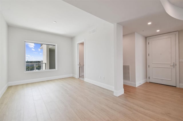 unfurnished room featuring light hardwood / wood-style flooring