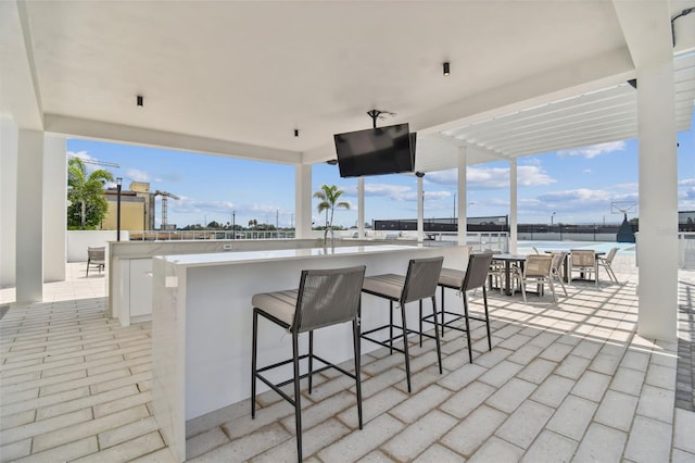 view of patio / terrace featuring an outdoor bar