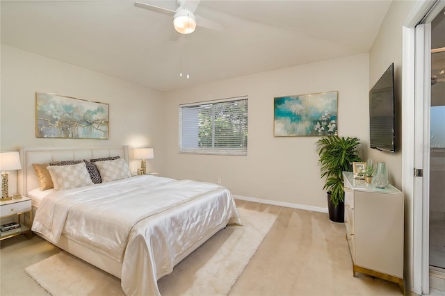 bedroom with baseboards, a ceiling fan, and light colored carpet