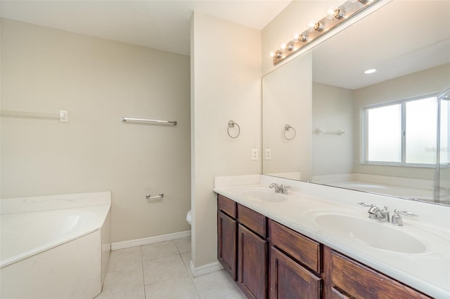 full bath with a sink, a bath, and tile patterned floors