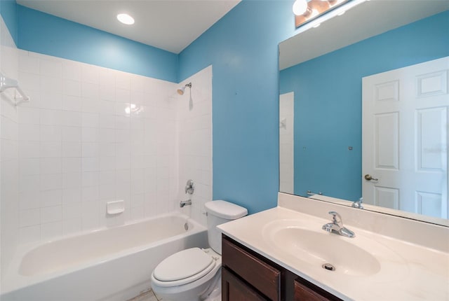 bathroom with shower / washtub combination, vanity, and toilet