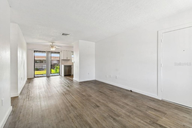 unfurnished living room featuring ceiling fan, a textured ceiling, and hardwood / wood-style flooring