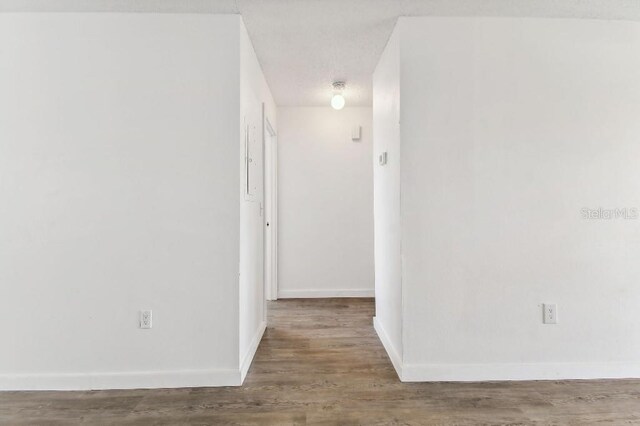 corridor featuring hardwood / wood-style flooring