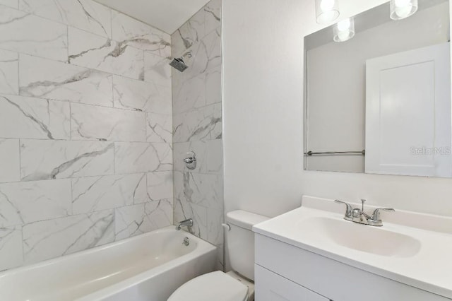 full bathroom with toilet, tiled shower / bath combo, and vanity