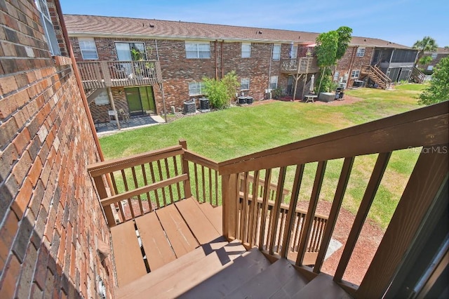 deck with central AC and a yard